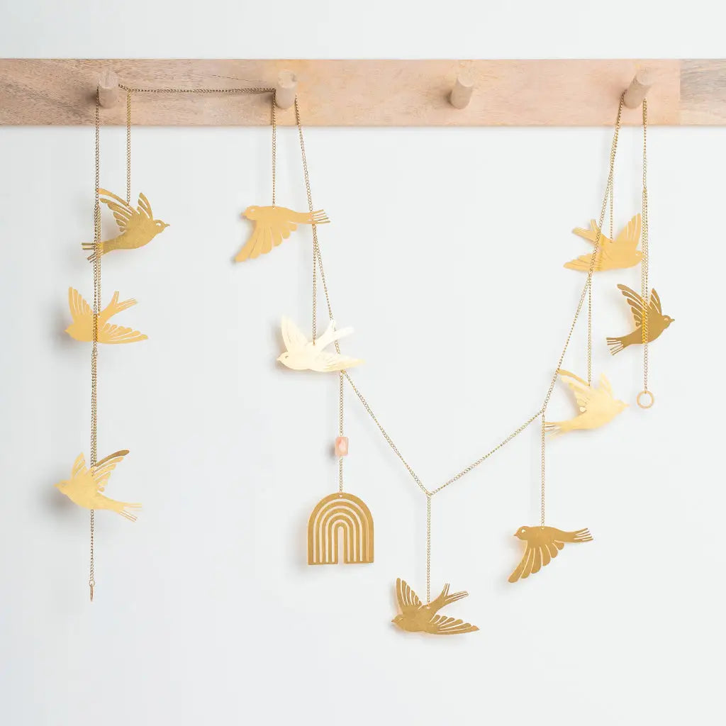 brass string of birds