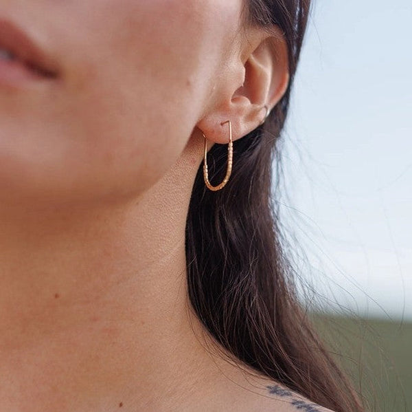 gold beaded drape earrings